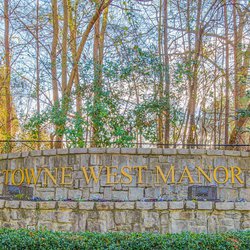 signage at Towne West Manor features spacious two & three bedroom apartment homes