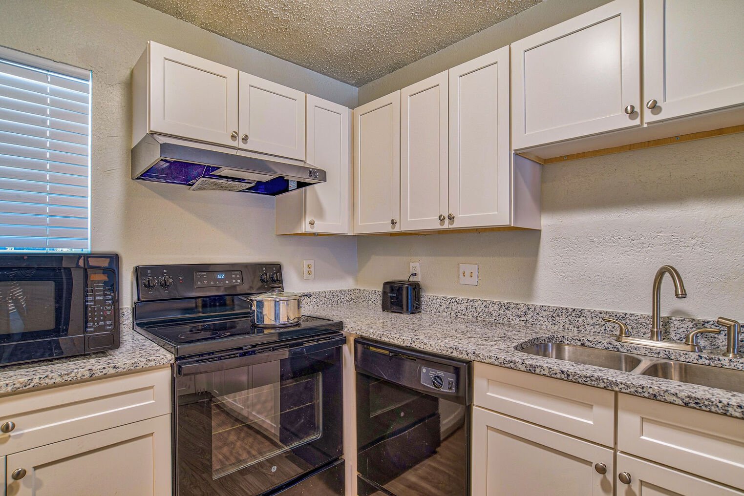 kitchen at Towne West Manor features spacious two & three bedroom apartment homes